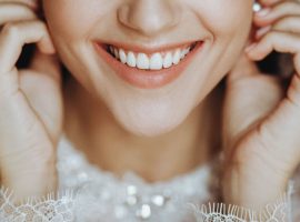 charming-bride-with-perfect-skin-touches-her-earring-tender