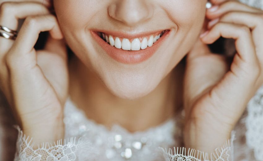 charming-bride-with-perfect-skin-touches-her-earring-tender